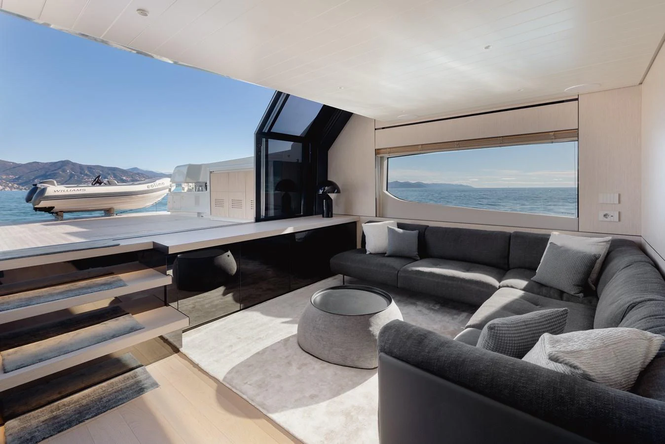 The salon offers a spacious and modern seating area with a stunning view of the water. aboard EOLINO Yacht for Sale