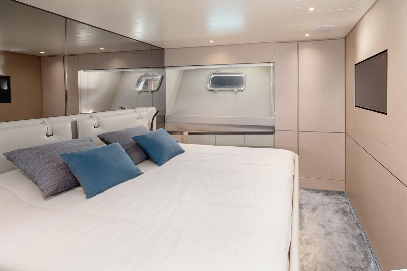The stateroom features a spacious bed with elegant bedding and modern furnishings. aboard EOLINO Yacht for Sale