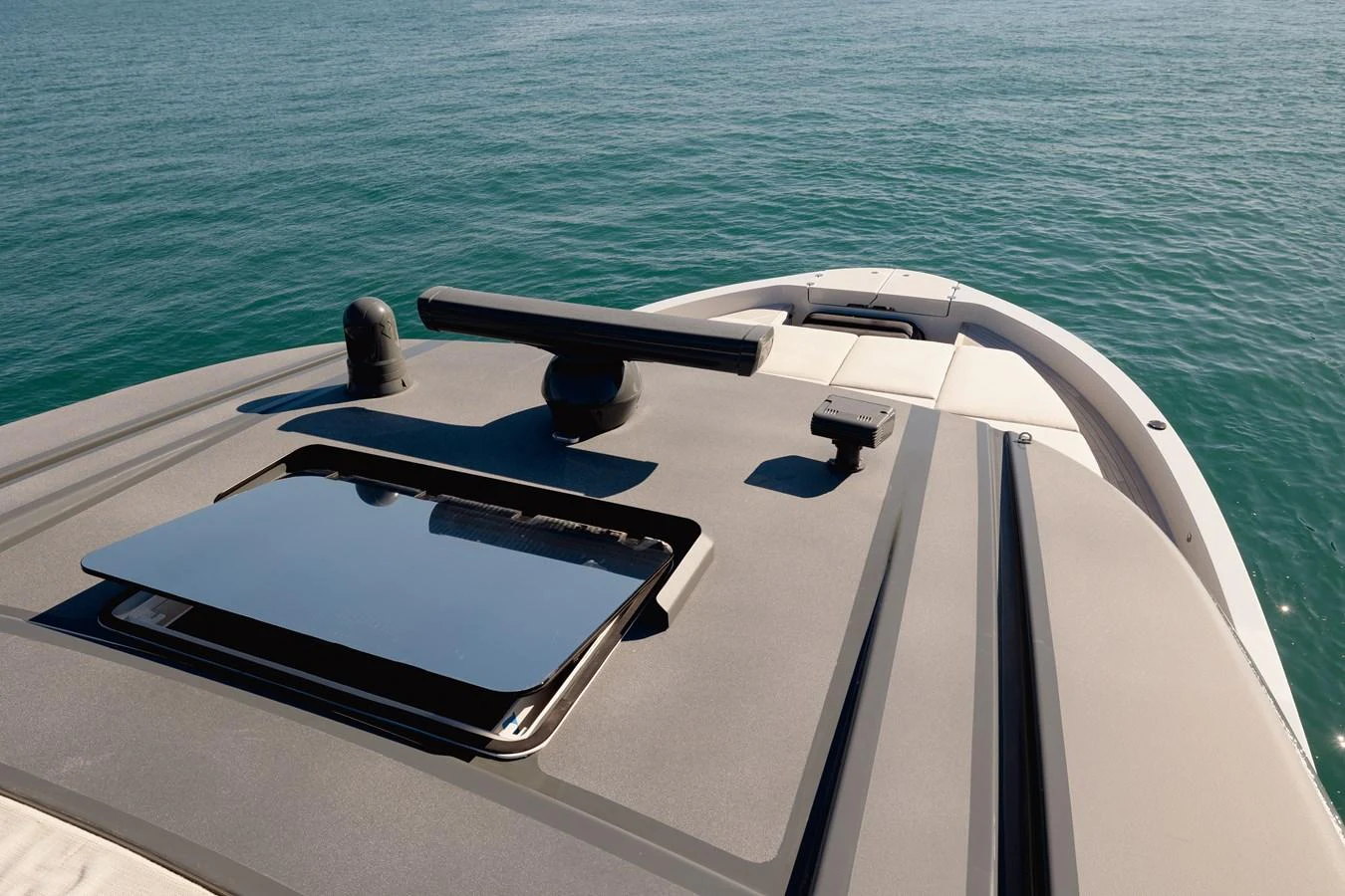 A close-up view of the yacht's bow with sleek design elements and a calm sea in the background. aboard EOLINO Yacht for Sale
