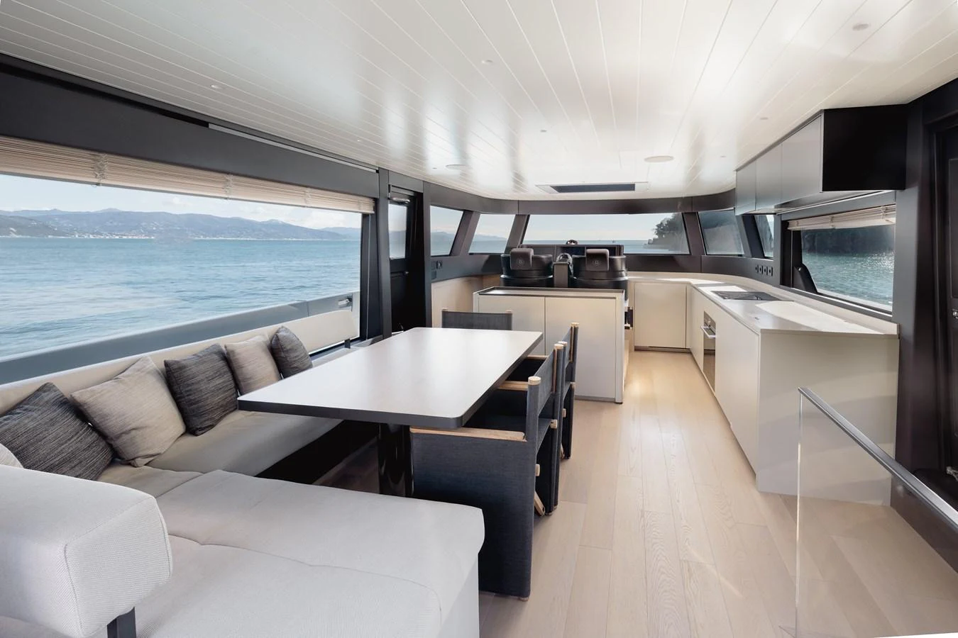 The yacht's salon offers a spacious and modern living area with panoramic views of the sea. aboard EOLINO Yacht for Sale