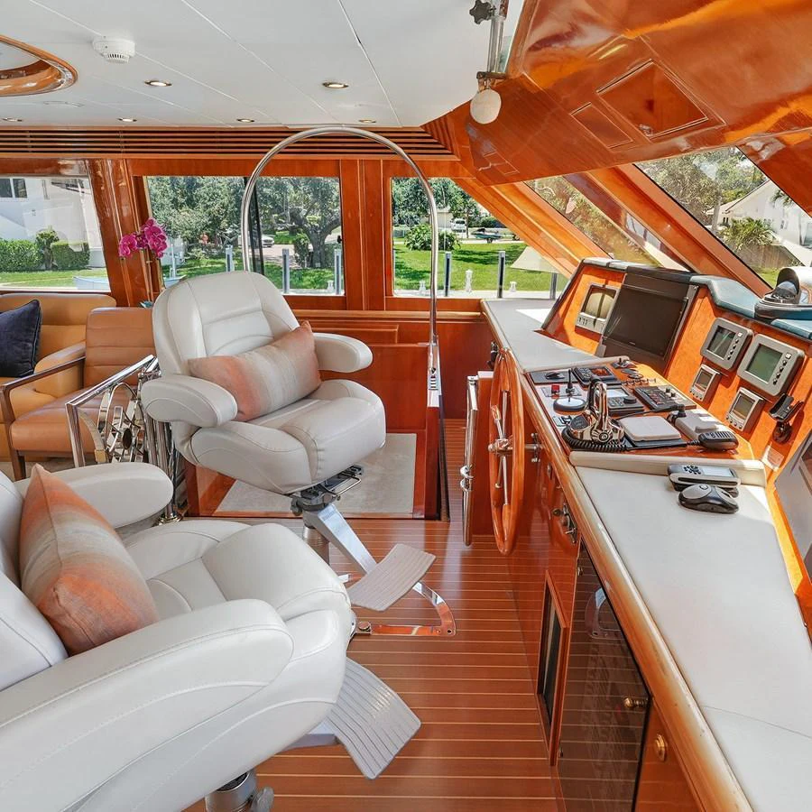 The helm station features luxurious seating and state-of-the-art navigation equipment. aboard MILES AWEIGH Yacht for Sale