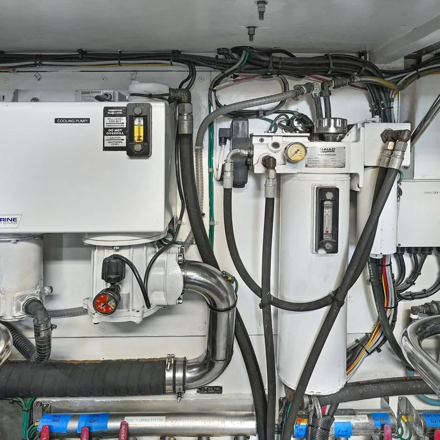 The image showcases the technical and mechanical components within the yacht's engine room. aboard MILES AWEIGH Yacht for Sale