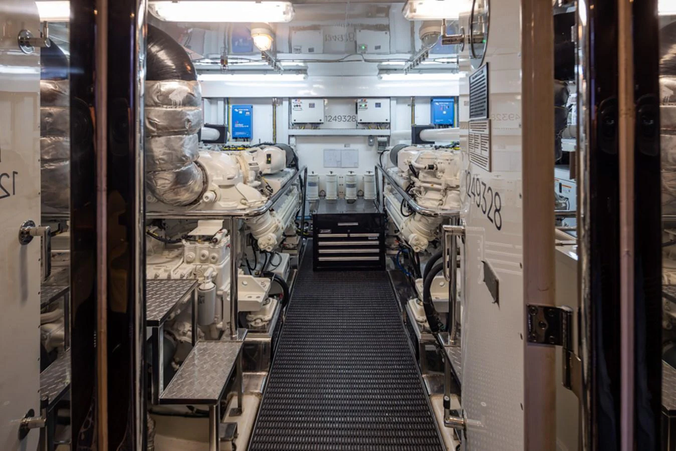 The image showcases the well-maintained engine room of the yacht, featuring advanced machinery and equipment. aboard RHONDAVOUS Yacht for Sale