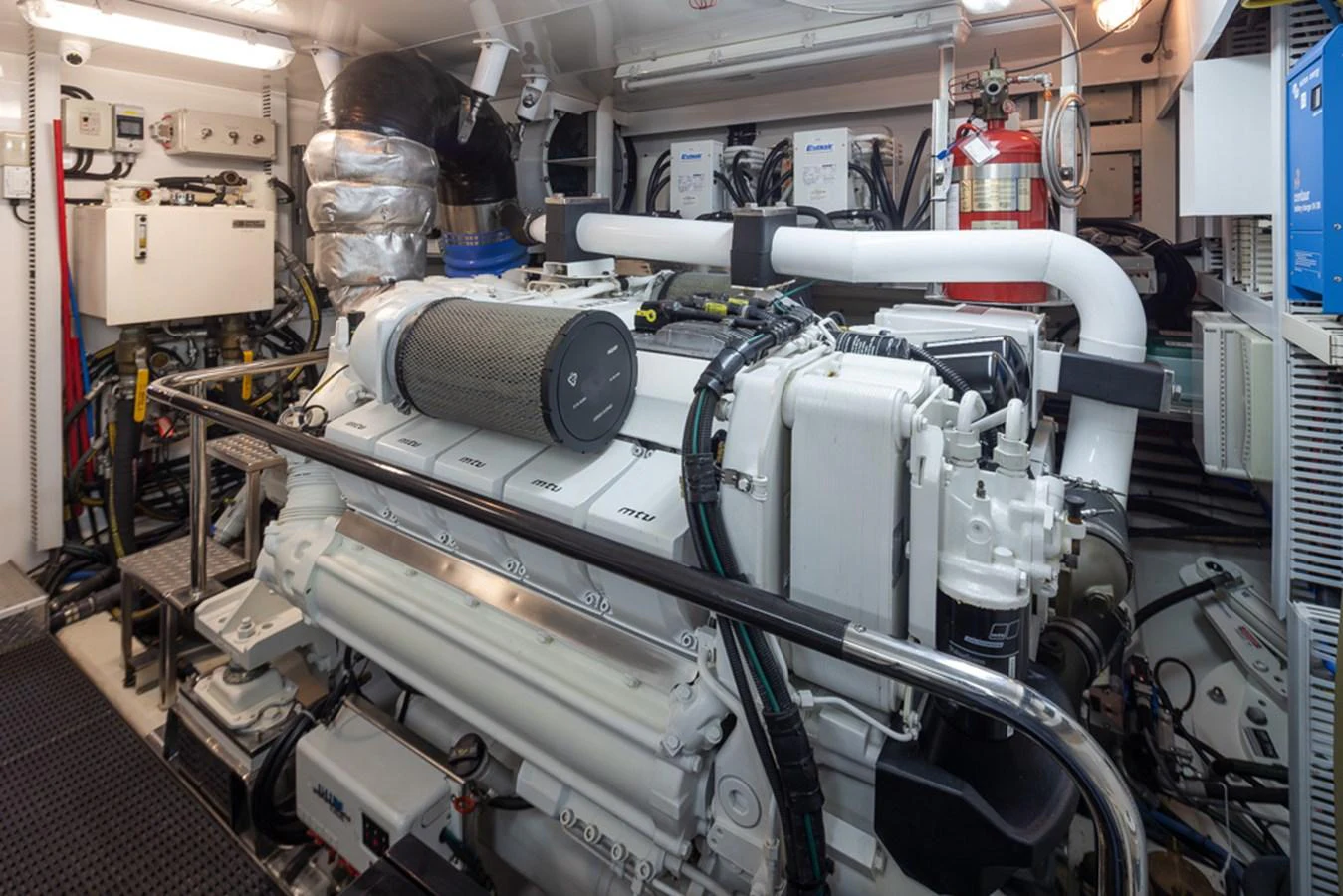 The image showcases the well-maintained engine room of the yacht, highlighting its powerful machinery and organized layout. aboard RHONDAVOUS Yacht for Sale