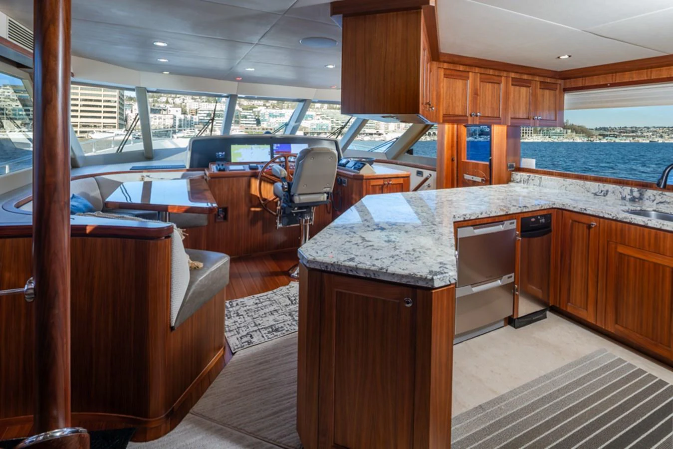 The helm area features a spacious layout with a modern control station and a well-appointed galley. aboard RHONDAVOUS Yacht for Sale