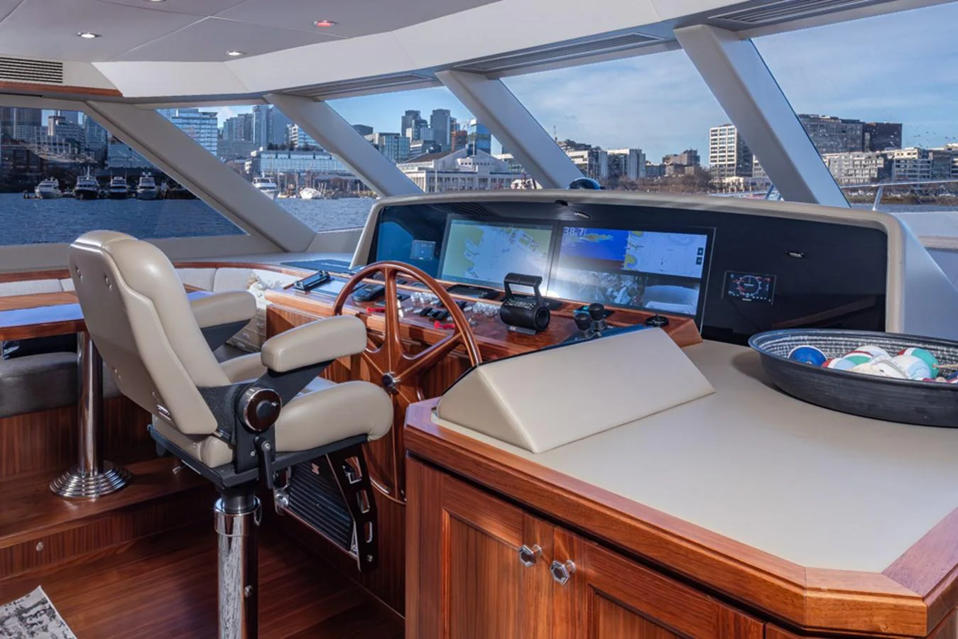 The helm station features advanced navigation equipment and a comfortable captain's chair with a panoramic view of the surroundings. aboard RHONDAVOUS Yacht for Sale