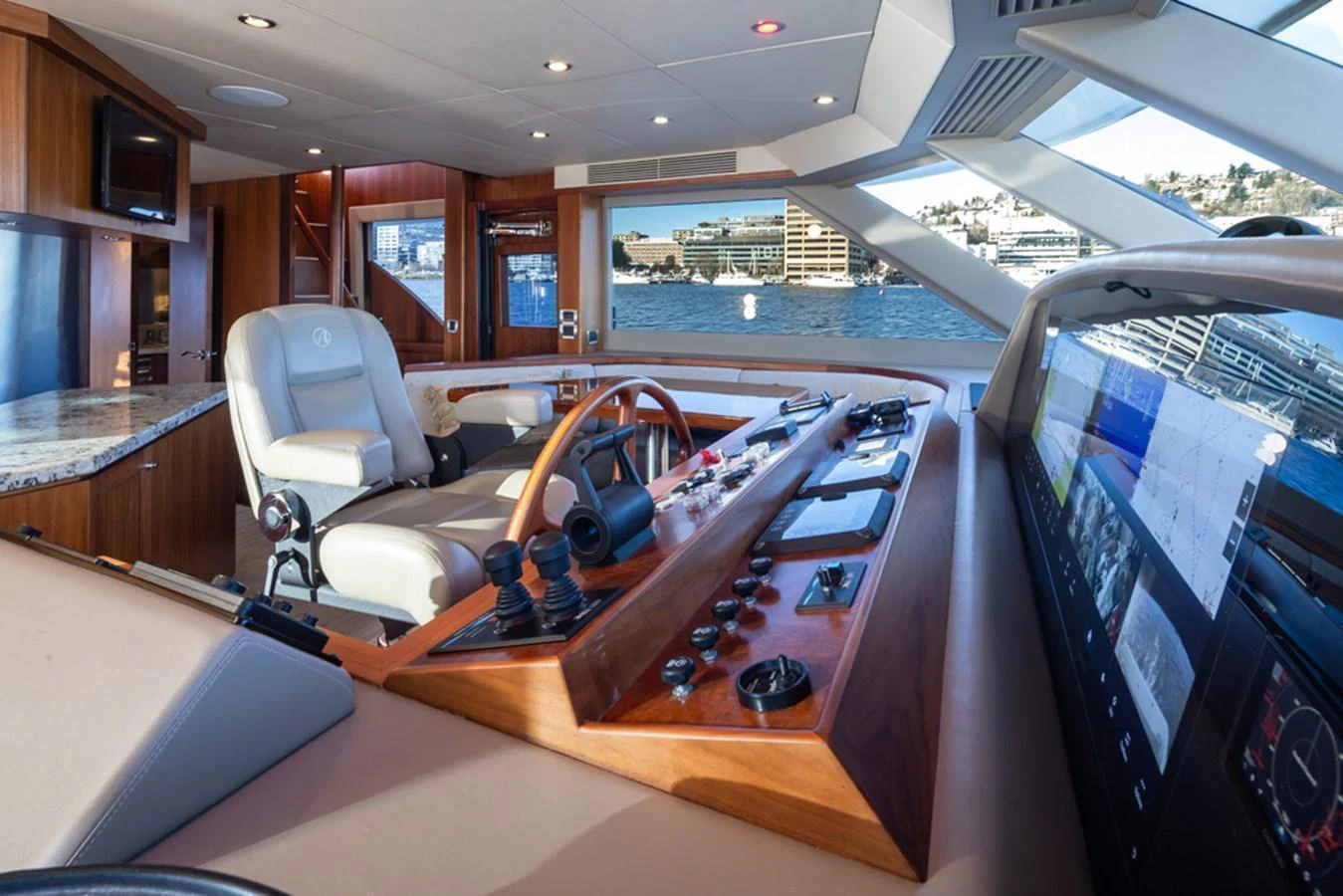 The helm station offers a sophisticated command center with panoramic views of the water. aboard RHONDAVOUS Yacht for Sale