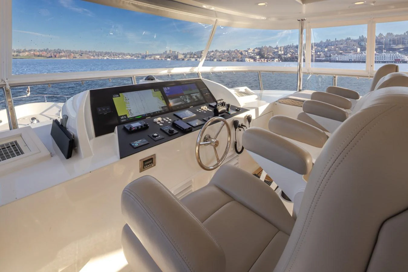 The helm station offers a panoramic view with advanced navigation systems and comfortable seating. aboard RHONDAVOUS Yacht for Sale