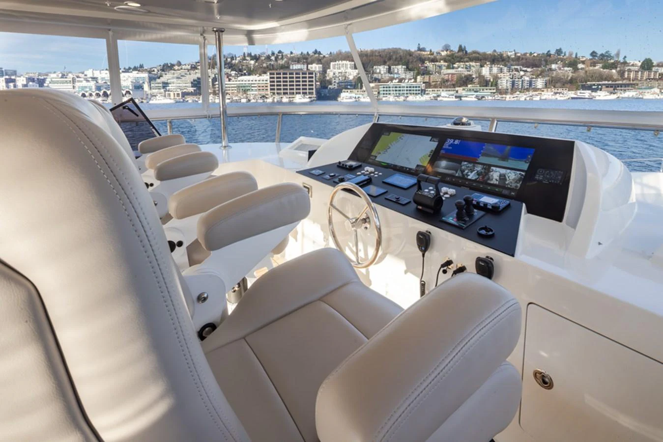 The helm station offers a commanding view with state-of-the-art navigation equipment and luxurious seating. aboard RHONDAVOUS Yacht for Sale