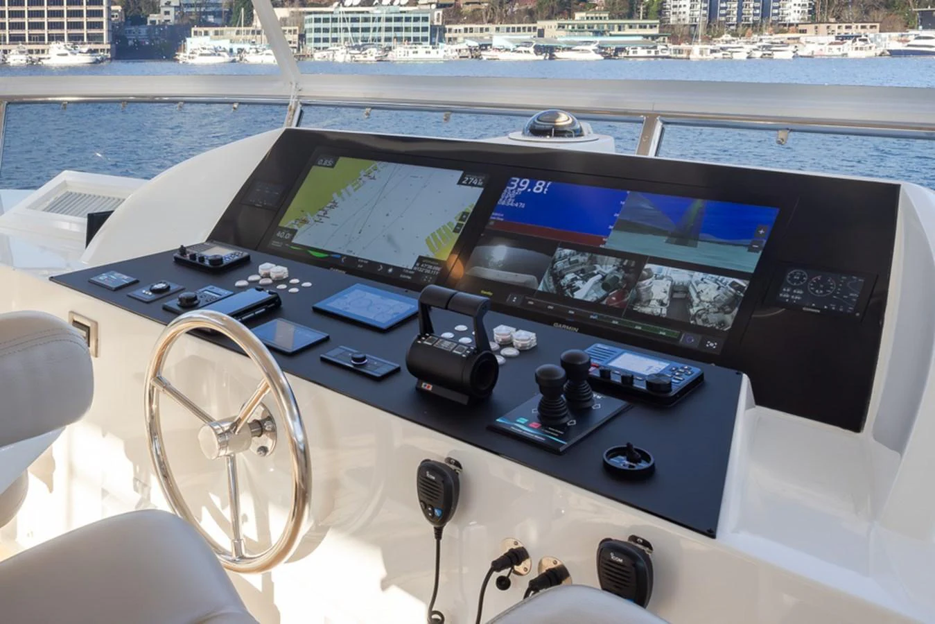 The helm station features advanced navigation and control systems with a panoramic view of the water. aboard RHONDAVOUS Yacht for Sale