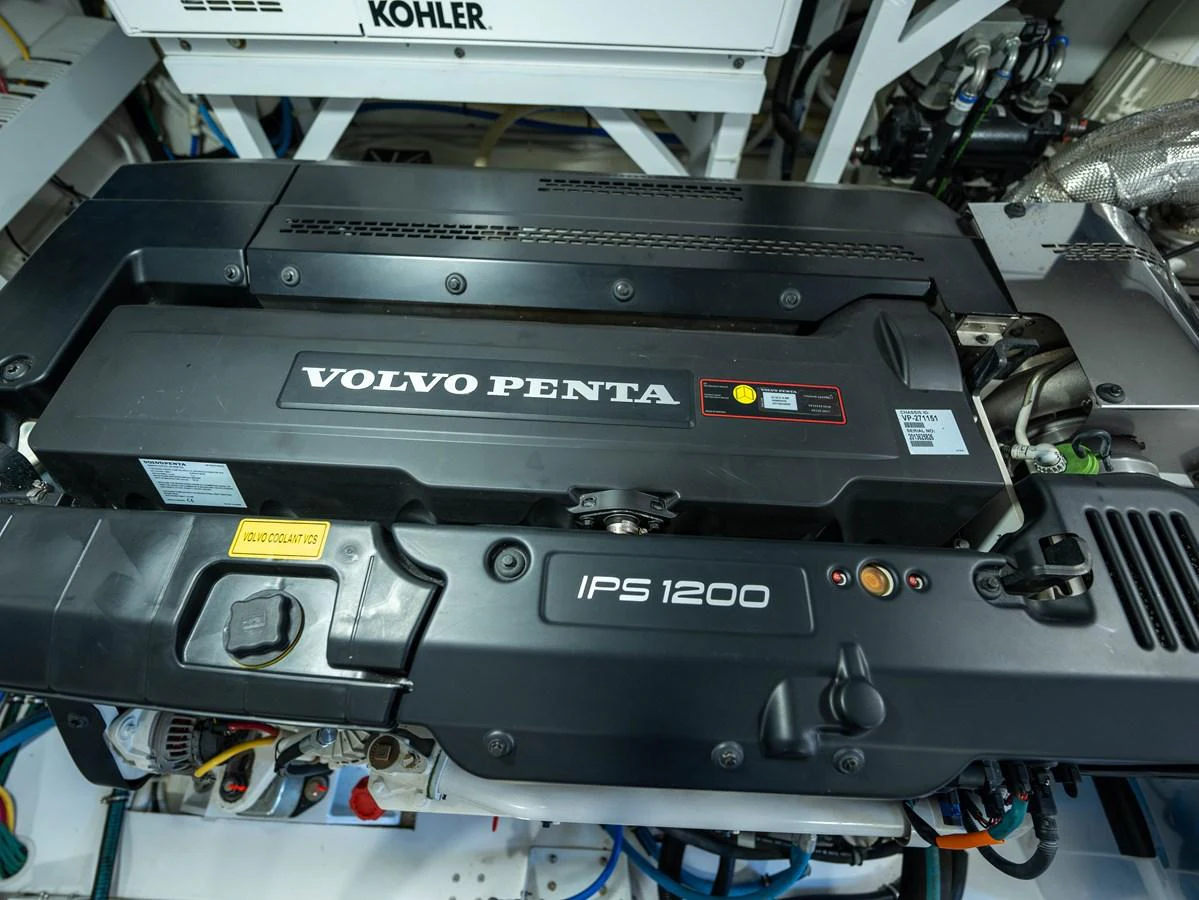 The image showcases a powerful Volvo Penta IPS 1200 engine in the yacht's engine room. aboard SUB-PAR Yacht for Sale