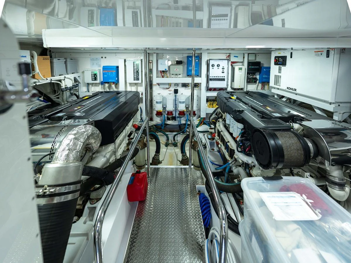 The yacht's engine room showcases powerful machinery and well-organized systems. aboard SUB-PAR Yacht for Sale