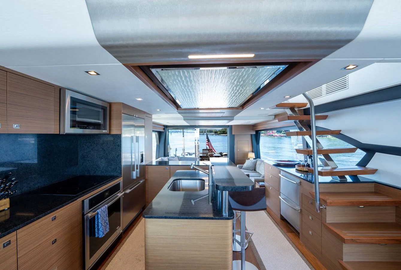 The yacht's galley features modern appliances and sleek design, offering a spacious and functional cooking area. aboard SUB-PAR Yacht for Sale