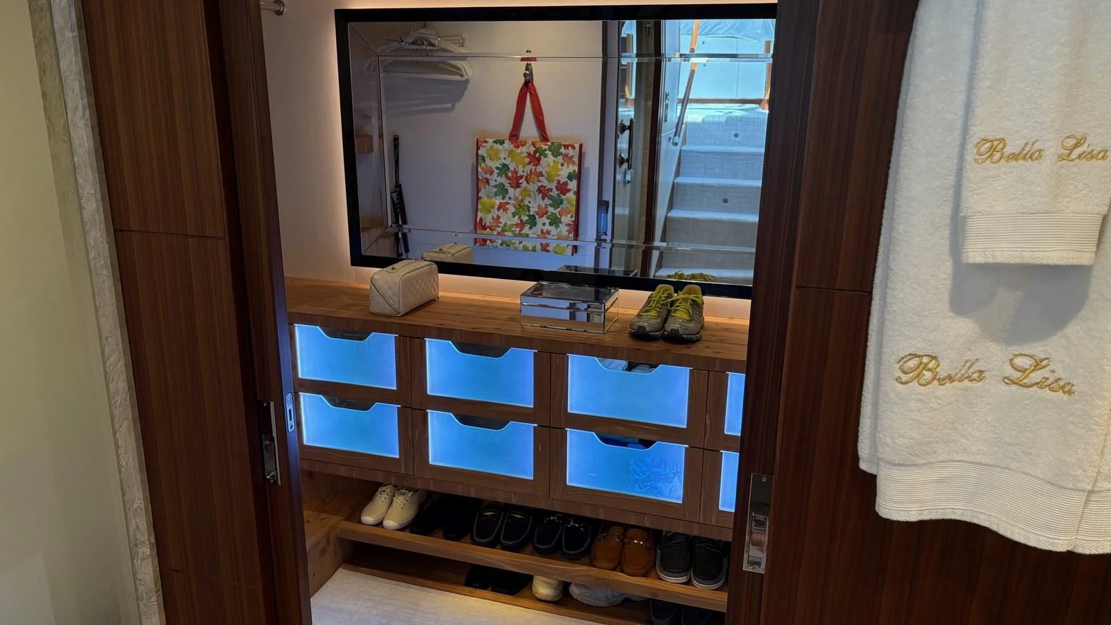A well-organized interior space featuring storage compartments and a mirror. aboard BELLA LISA Yacht for Sale
