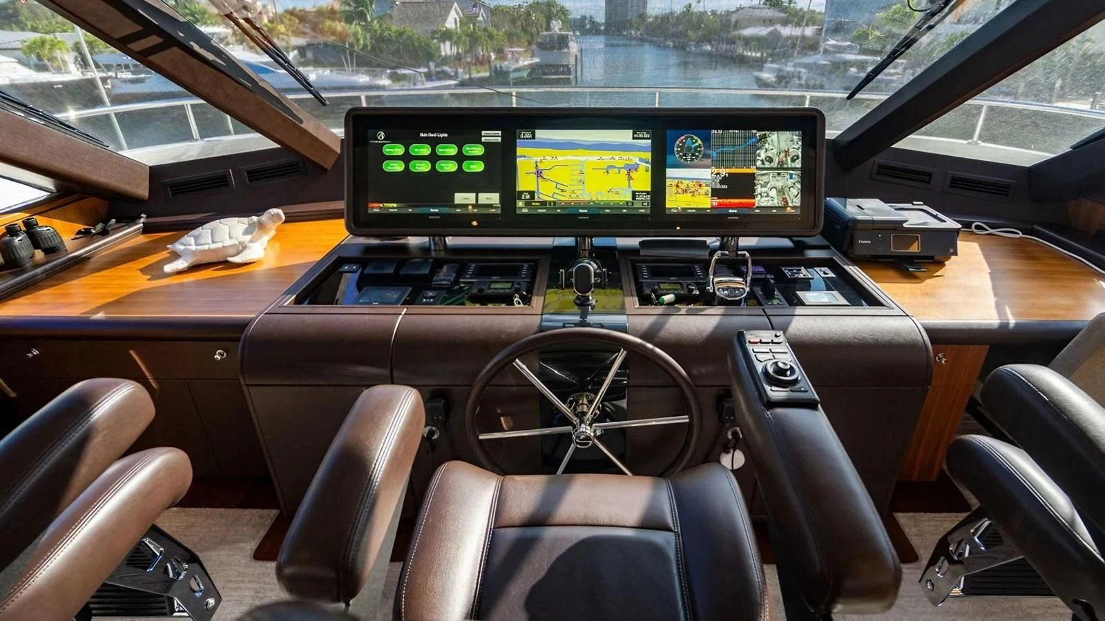 The helm station features advanced navigation equipment and luxurious seating. aboard BELLA LISA Yacht for Sale