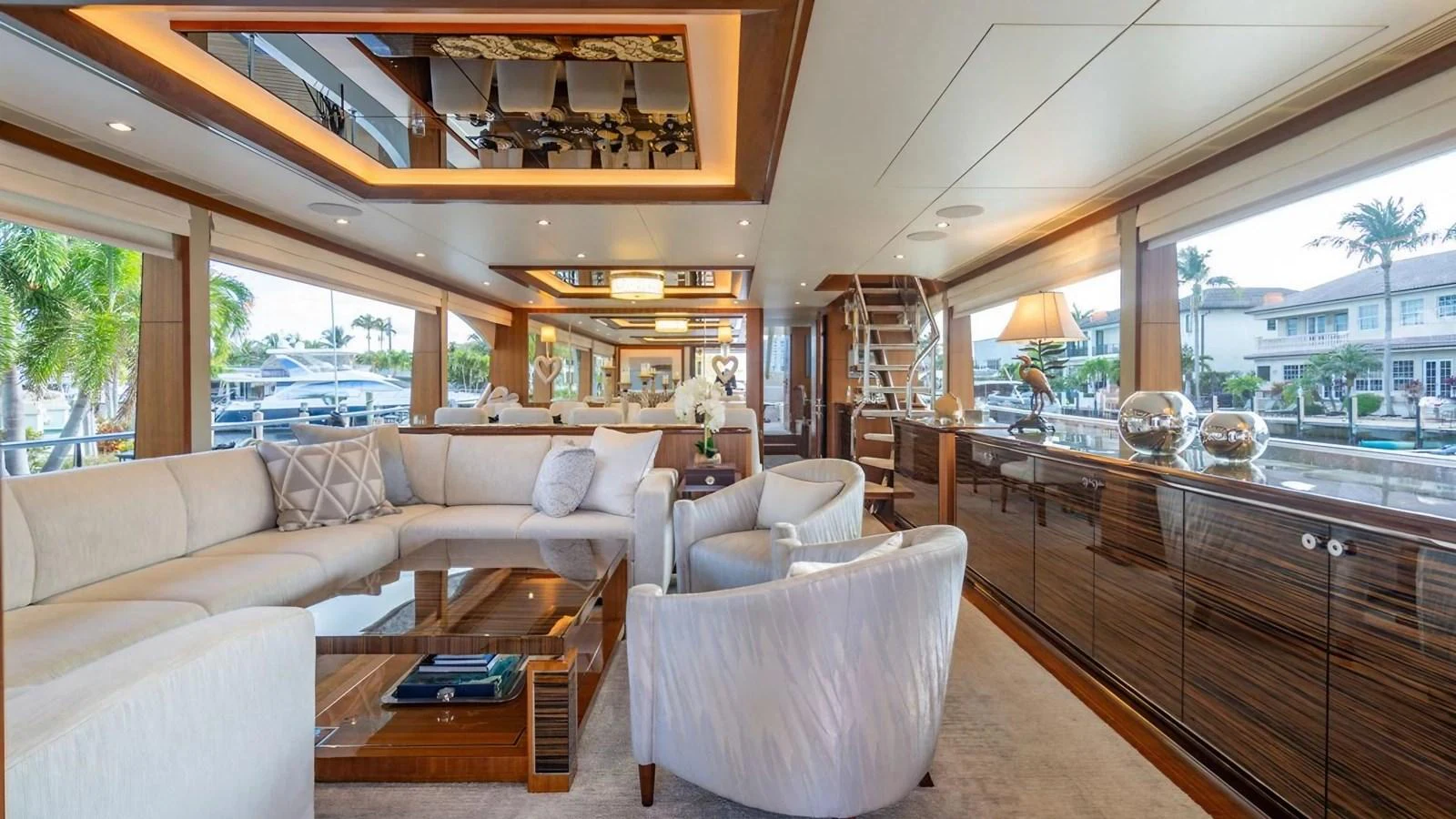The yacht's salon features luxurious seating with ample natural light and elegant decor. aboard BELLA LISA Yacht for Sale