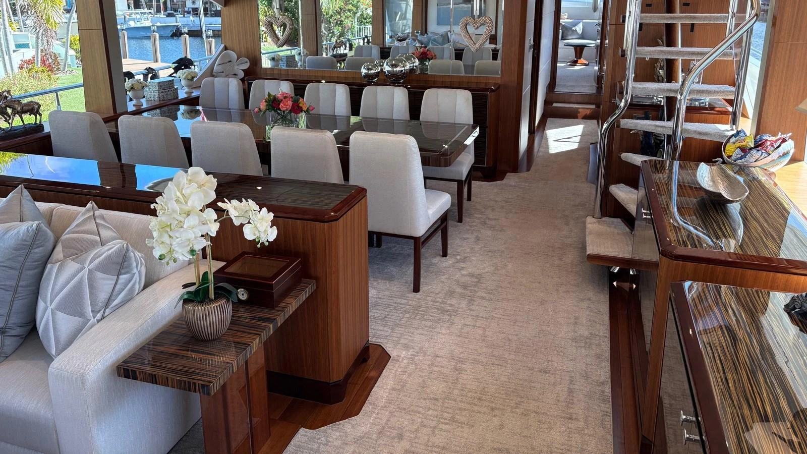 The salon features elegant dining and seating areas with luxurious finishes and ample natural light. aboard BELLA LISA Yacht for Sale