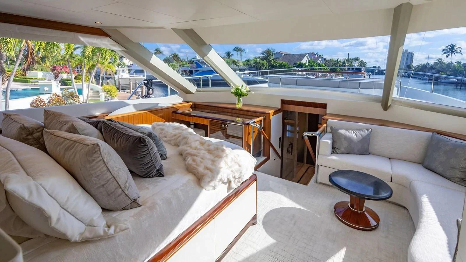 The yacht's salon offers a luxurious and spacious area with ample seating and large windows providing stunning views. aboard BELLA LISA Yacht for Sale