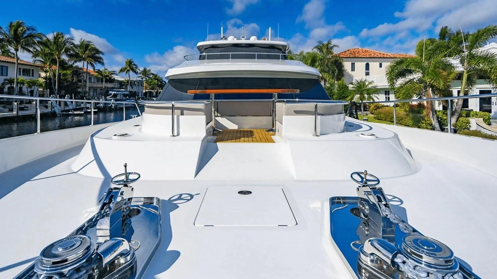 The foredeck of the yacht features a spacious and sleek design with polished metal fittings and a clear view of the surroundings. aboard BELLA LISA Yacht for Sale
