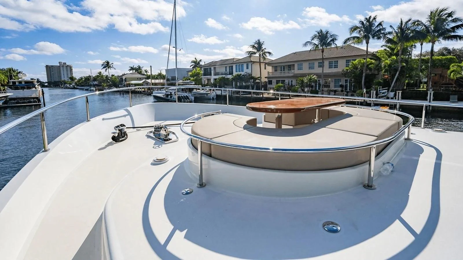 The foredeck offers a spacious area with a sunpad and a table, perfect for relaxation and enjoying the view. aboard BELLA LISA Yacht for Sale