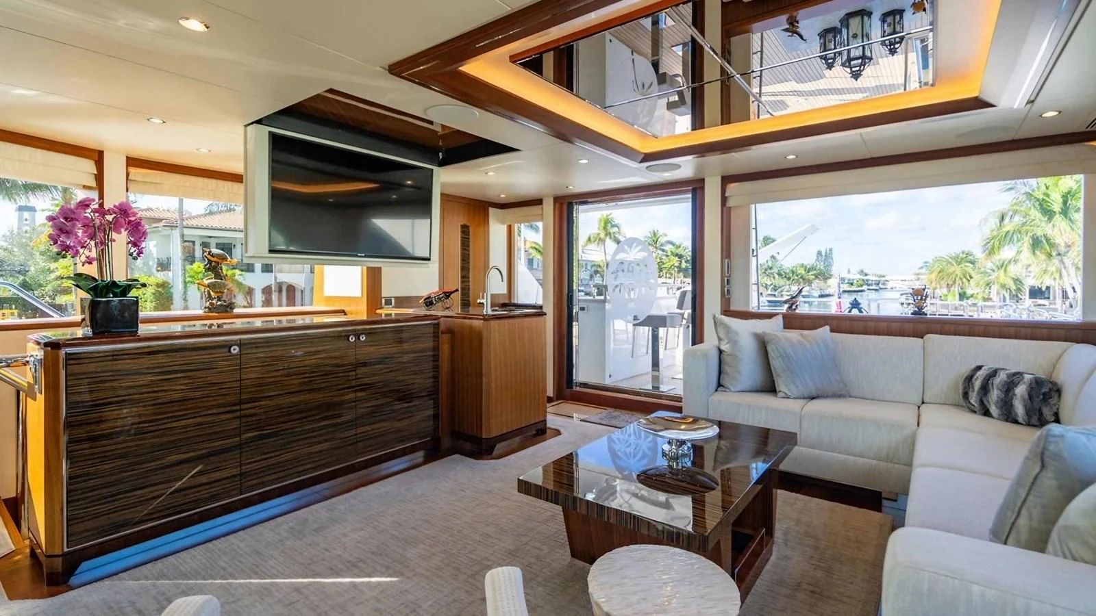 The yacht's salon features a spacious and elegant seating area with modern furnishings and ample natural light. aboard BELLA LISA Yacht for Sale