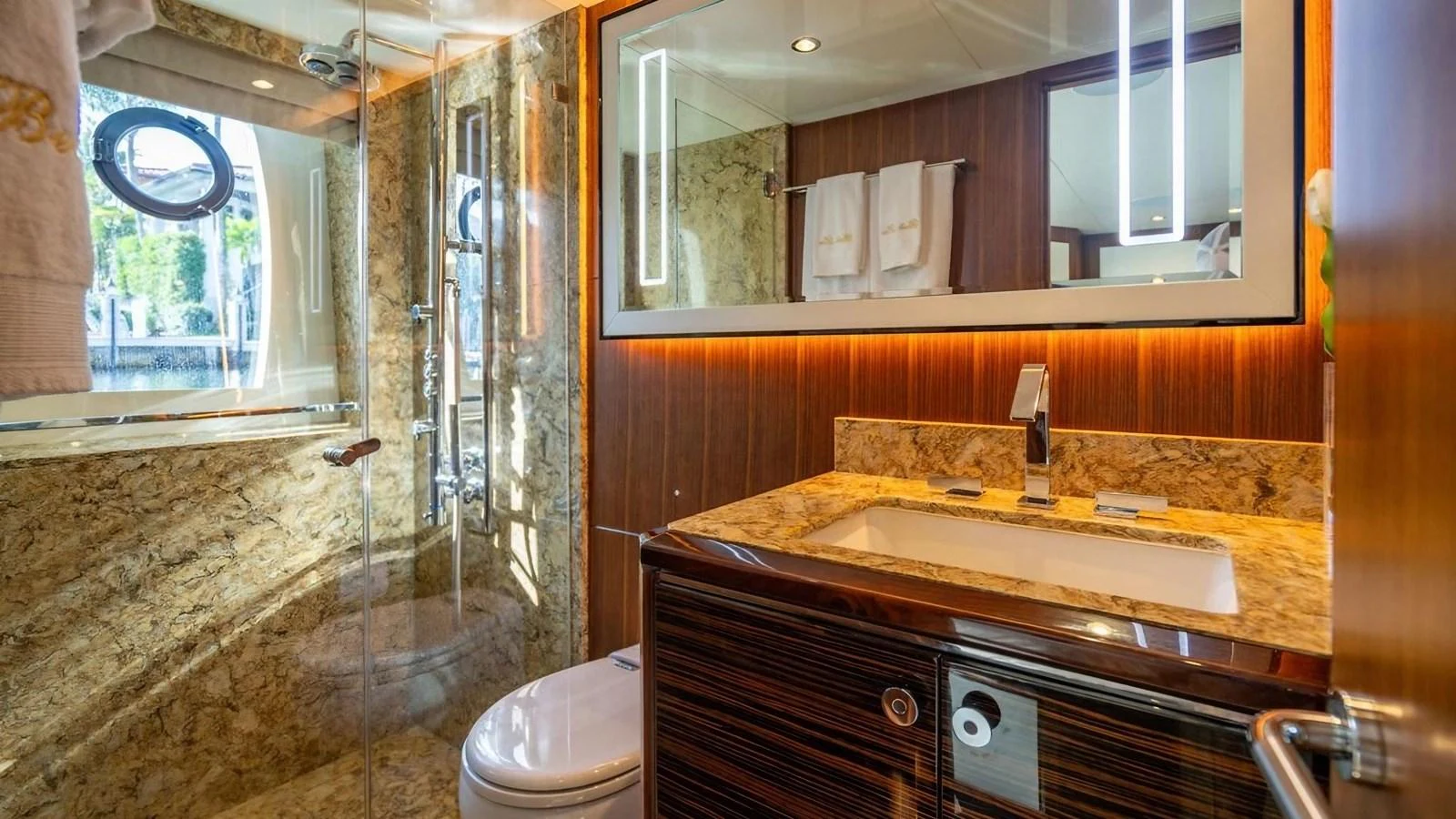 The yacht's bathroom features luxurious marble surfaces and modern fixtures. aboard BELLA LISA Yacht for Sale