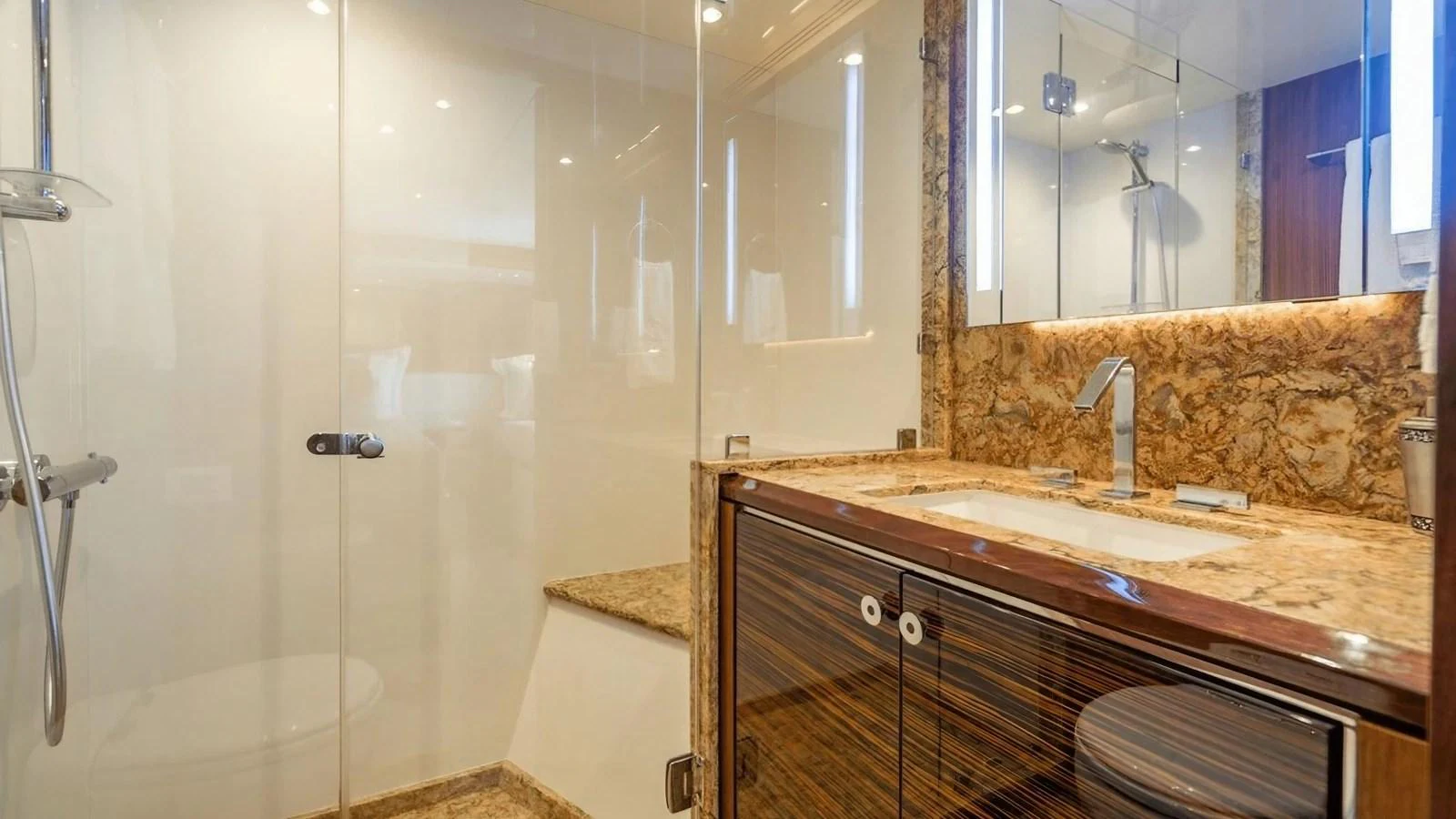 The yacht's bathroom features a luxurious design with a spacious shower and elegant fixtures. aboard BELLA LISA Yacht for Sale