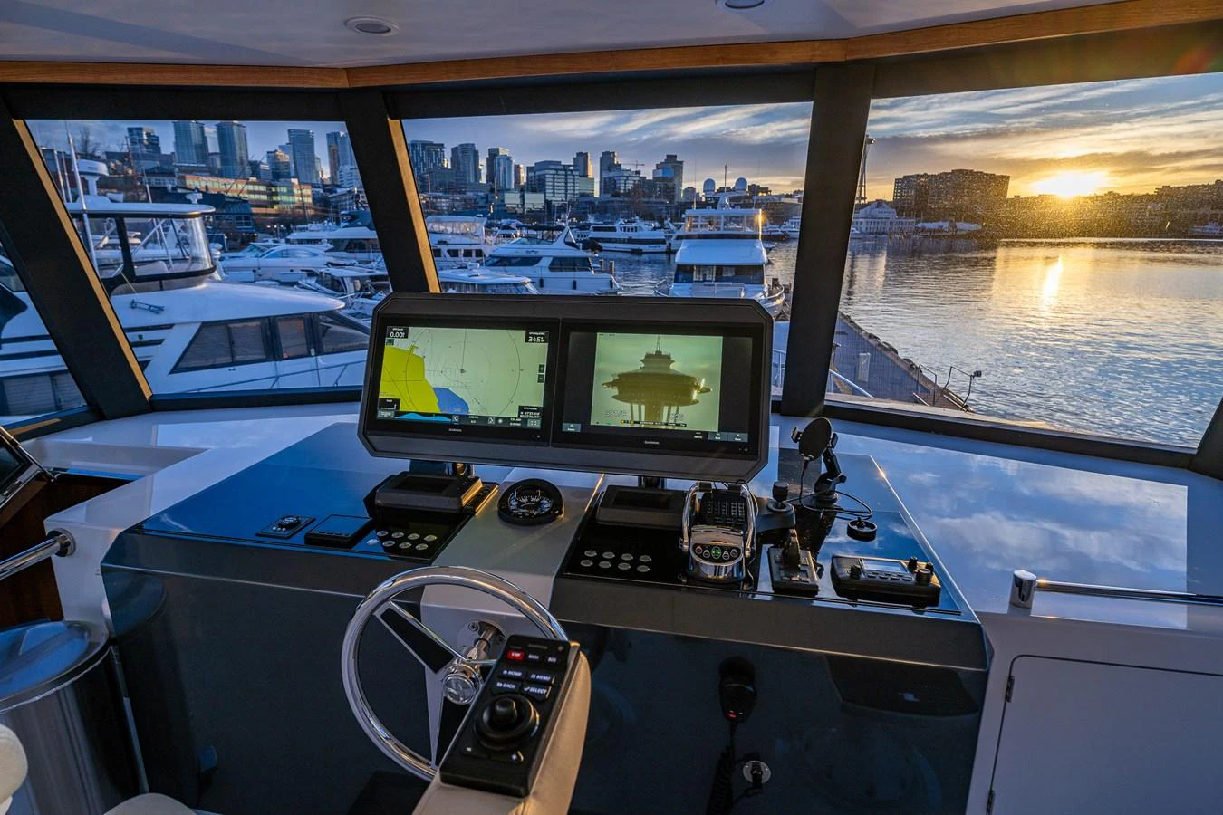 The helm offers a panoramic view of the marina, equipped with advanced navigation systems. aboard ISLAND BREEZE Yacht for Sale