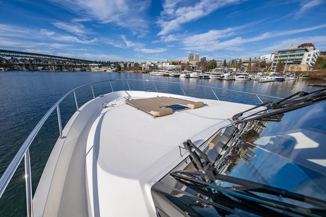 The yacht's foredeck offers a spacious sunbathing area with stunning views of the marina. aboard ISLAND BREEZE Yacht for Sale