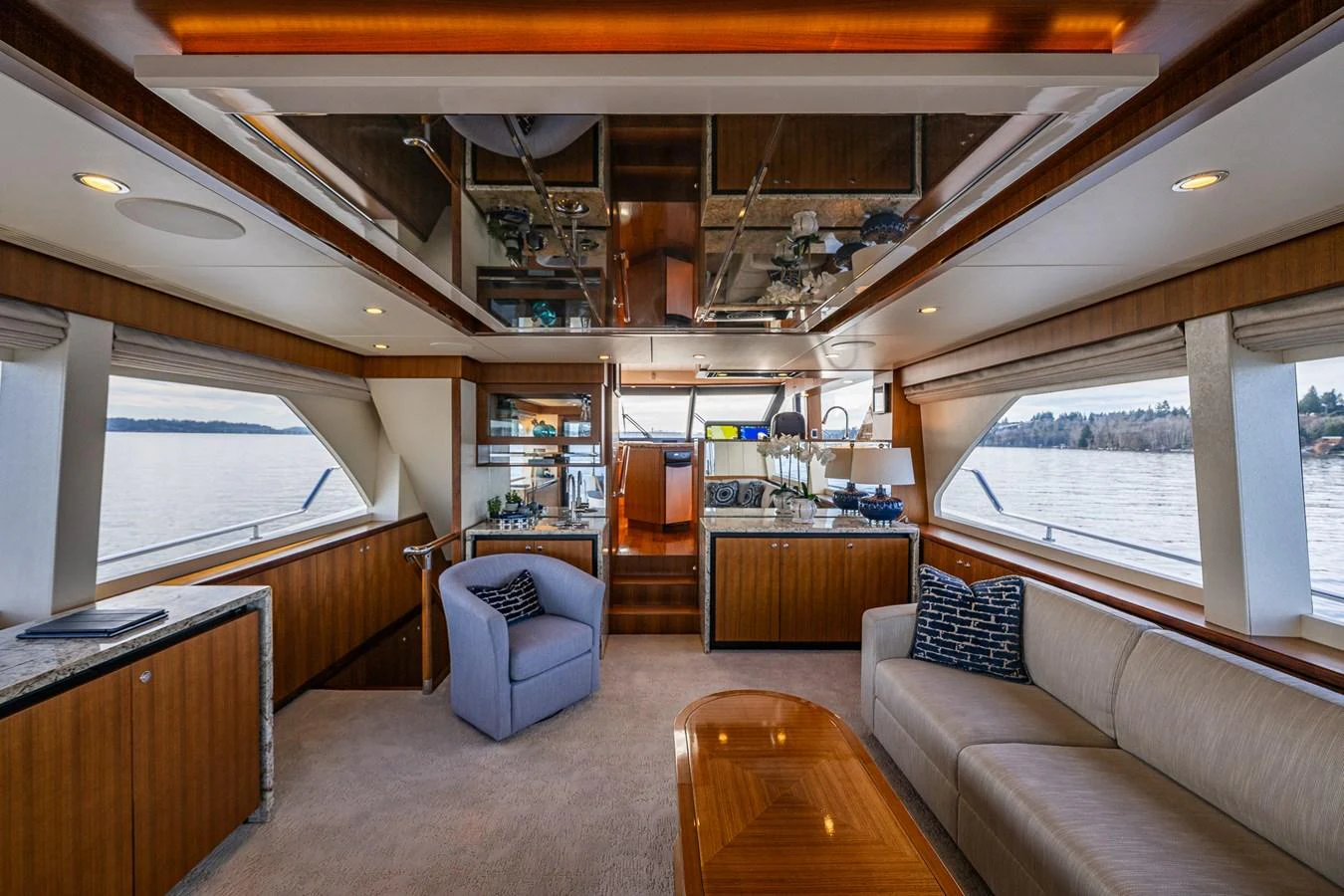 The salon offers a spacious and elegant area with comfortable seating and panoramic views. aboard ISLAND BREEZE Yacht for Sale