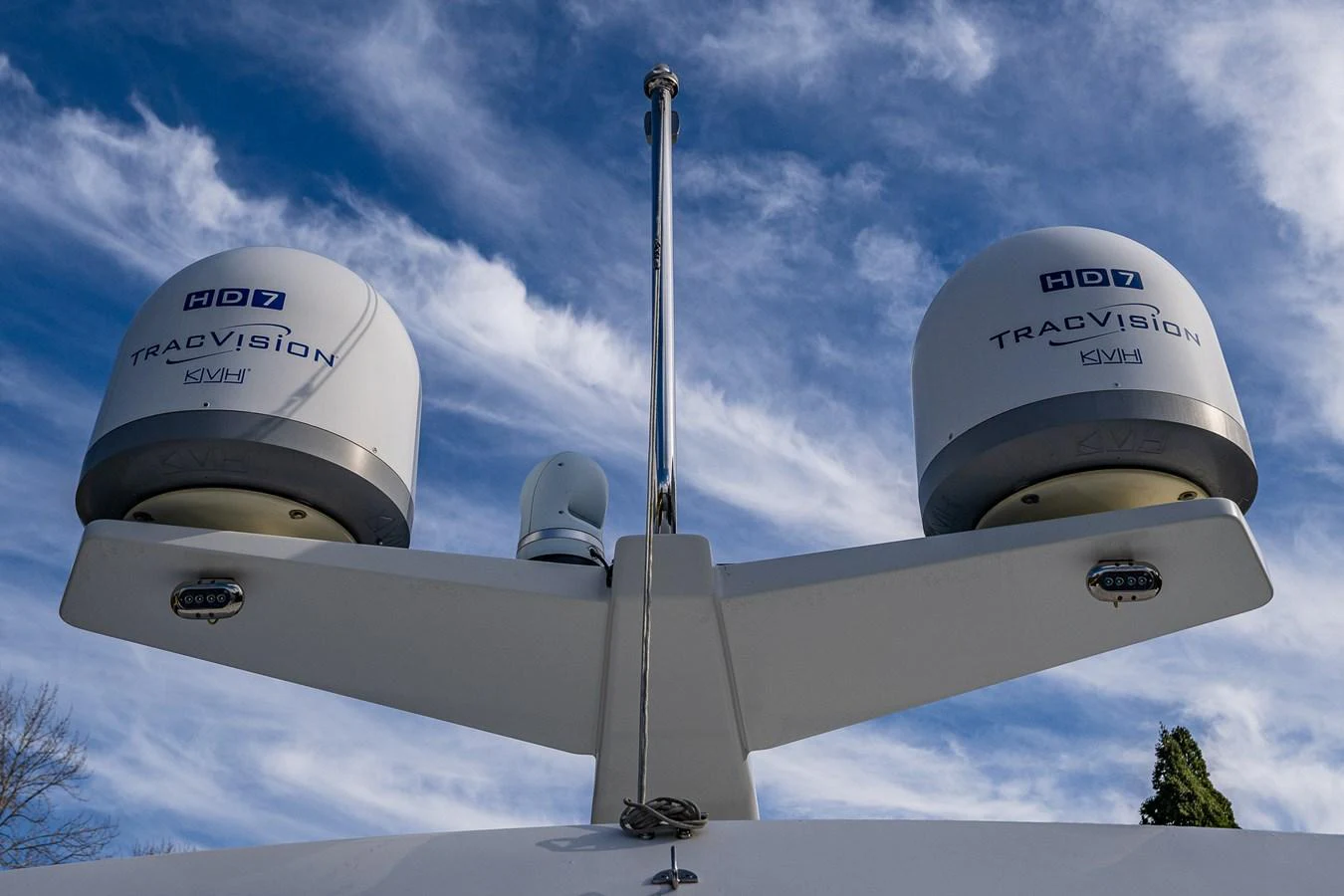 The image showcases the yacht's advanced radar and communication equipment against a clear blue sky. aboard ISLAND BREEZE Yacht for Sale