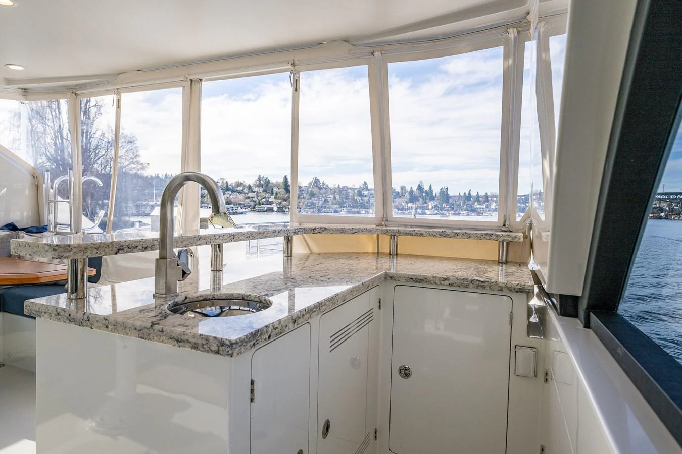 The yacht's galley features sleek countertops and large windows offering stunning water views. aboard ISLAND BREEZE Yacht for Sale
