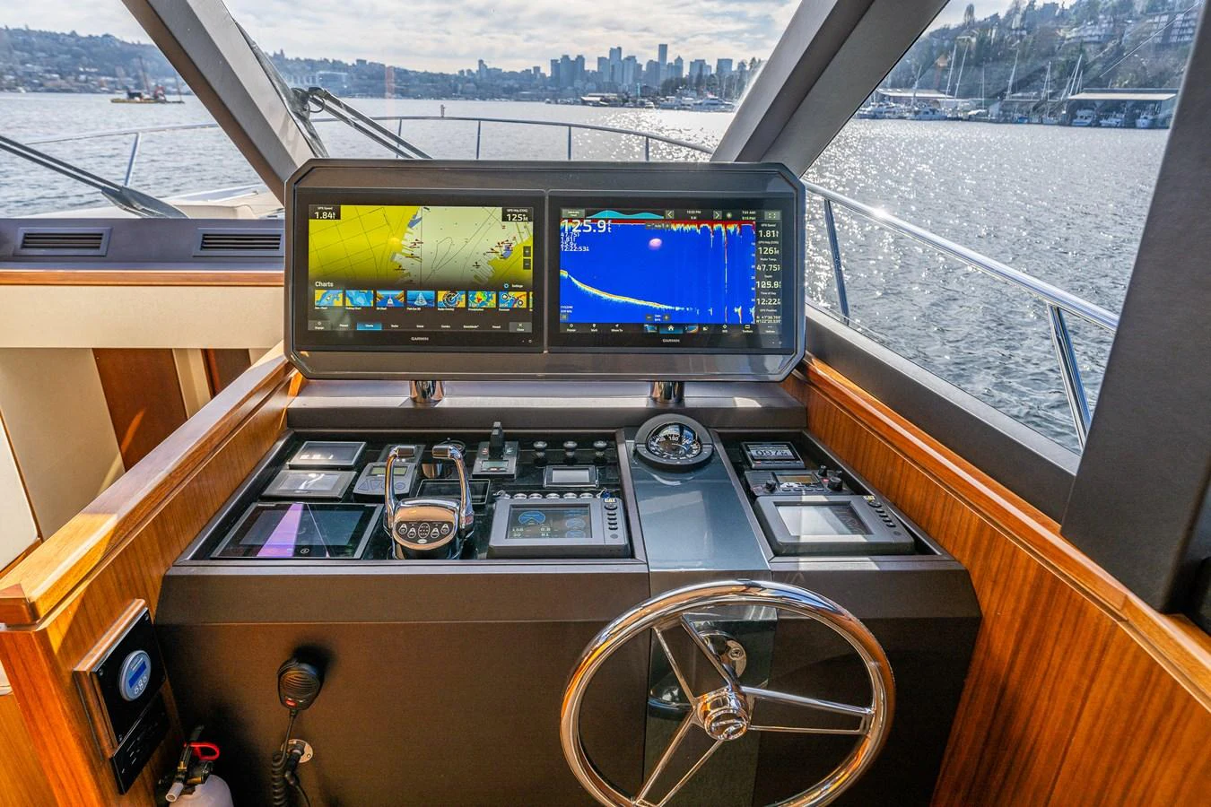 The helm station offers advanced navigation technology with a stunning view of the water. aboard ISLAND BREEZE Yacht for Sale