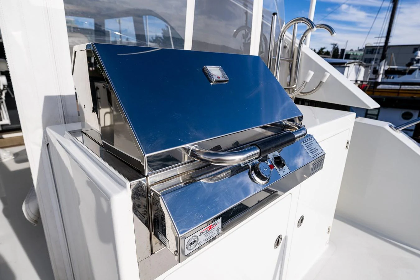 A sleek stainless steel grill is featured on the yacht's deck, perfect for outdoor cooking. aboard ISLAND BREEZE Yacht for Sale