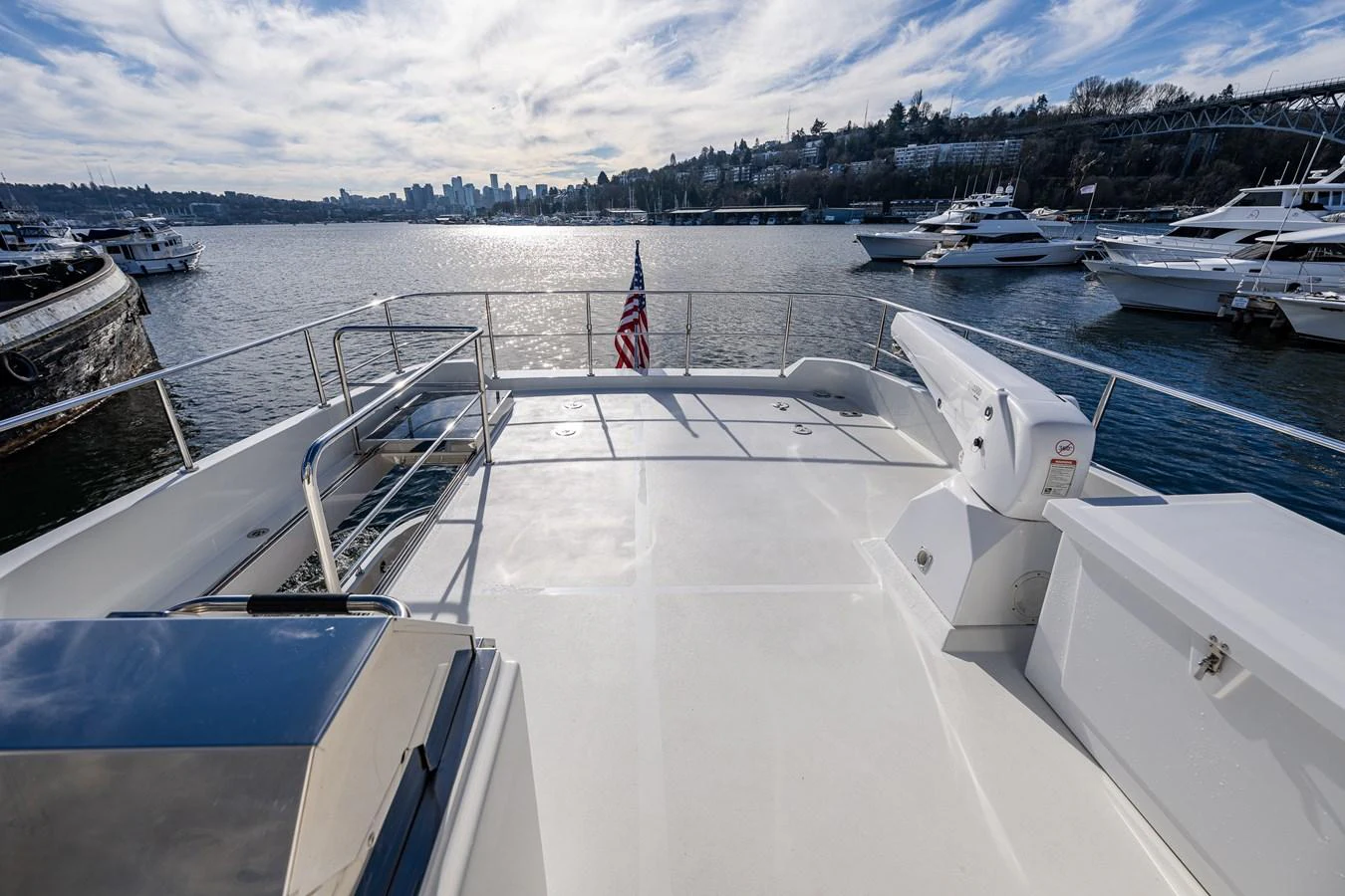 The flybridge offers a spacious and open area with a stunning view of the surrounding marina. aboard ISLAND BREEZE Yacht for Sale