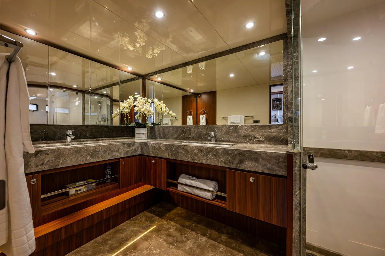 The yacht's bathroom features elegant marble countertops and modern fixtures, creating a luxurious and serene space. aboard ISLAND BREEZE Yacht for Sale