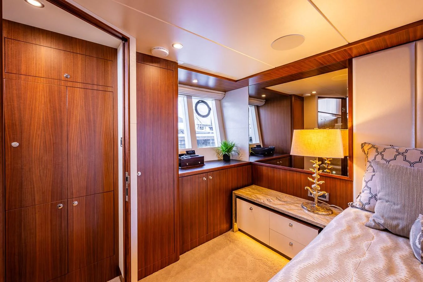 The yacht's interior features a cozy and well-lit cabin with elegant wooden finishes and modern decor. aboard ISLAND BREEZE Yacht for Sale