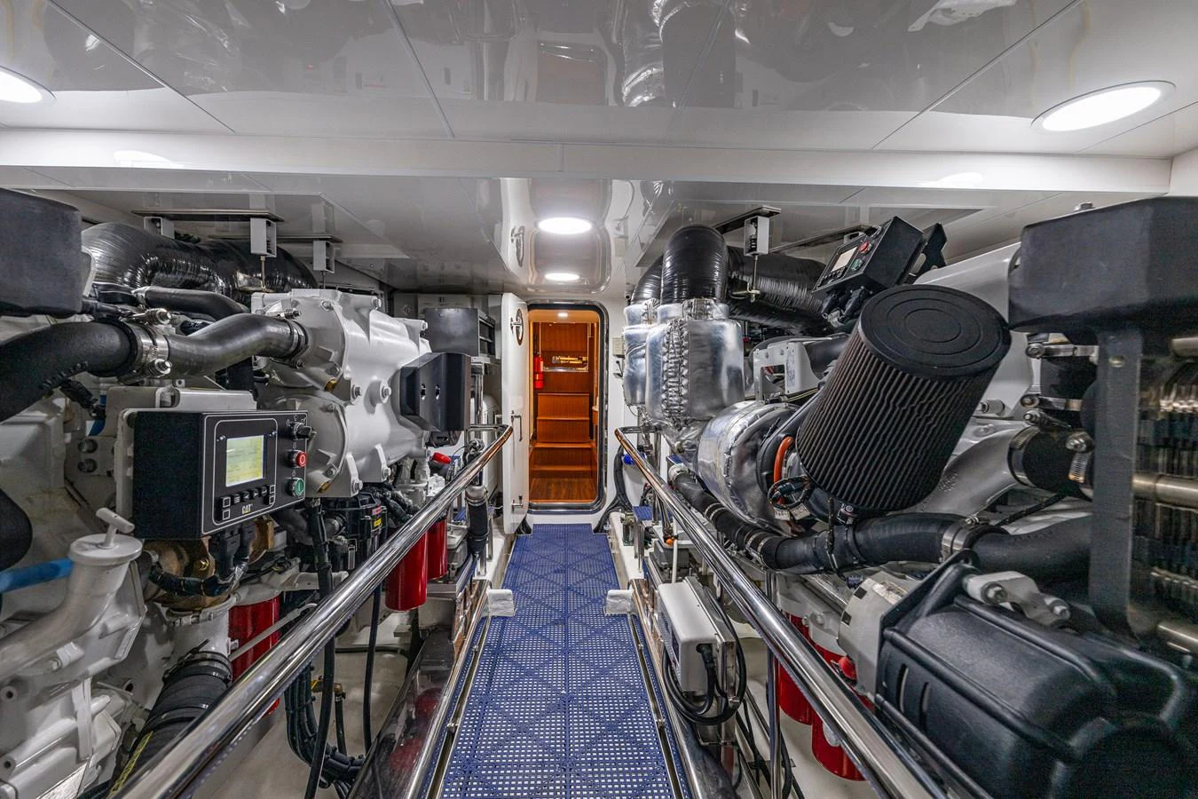 The yacht's engine room showcases advanced machinery and meticulous organization. aboard ISLAND BREEZE Yacht for Sale