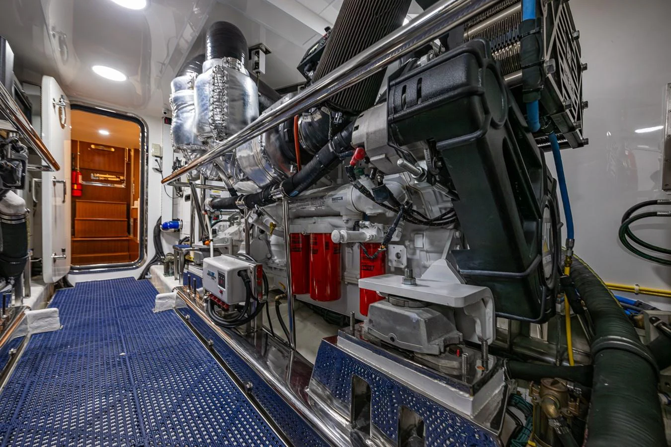 The image showcases the well-maintained engine room of the yacht, highlighting its advanced machinery and systems. aboard ISLAND BREEZE Yacht for Sale