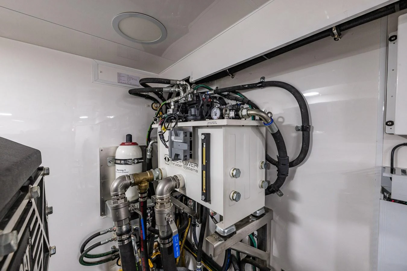 The image showcases the yacht's engine room with its mechanical components and systems. aboard ISLAND BREEZE Yacht for Sale
