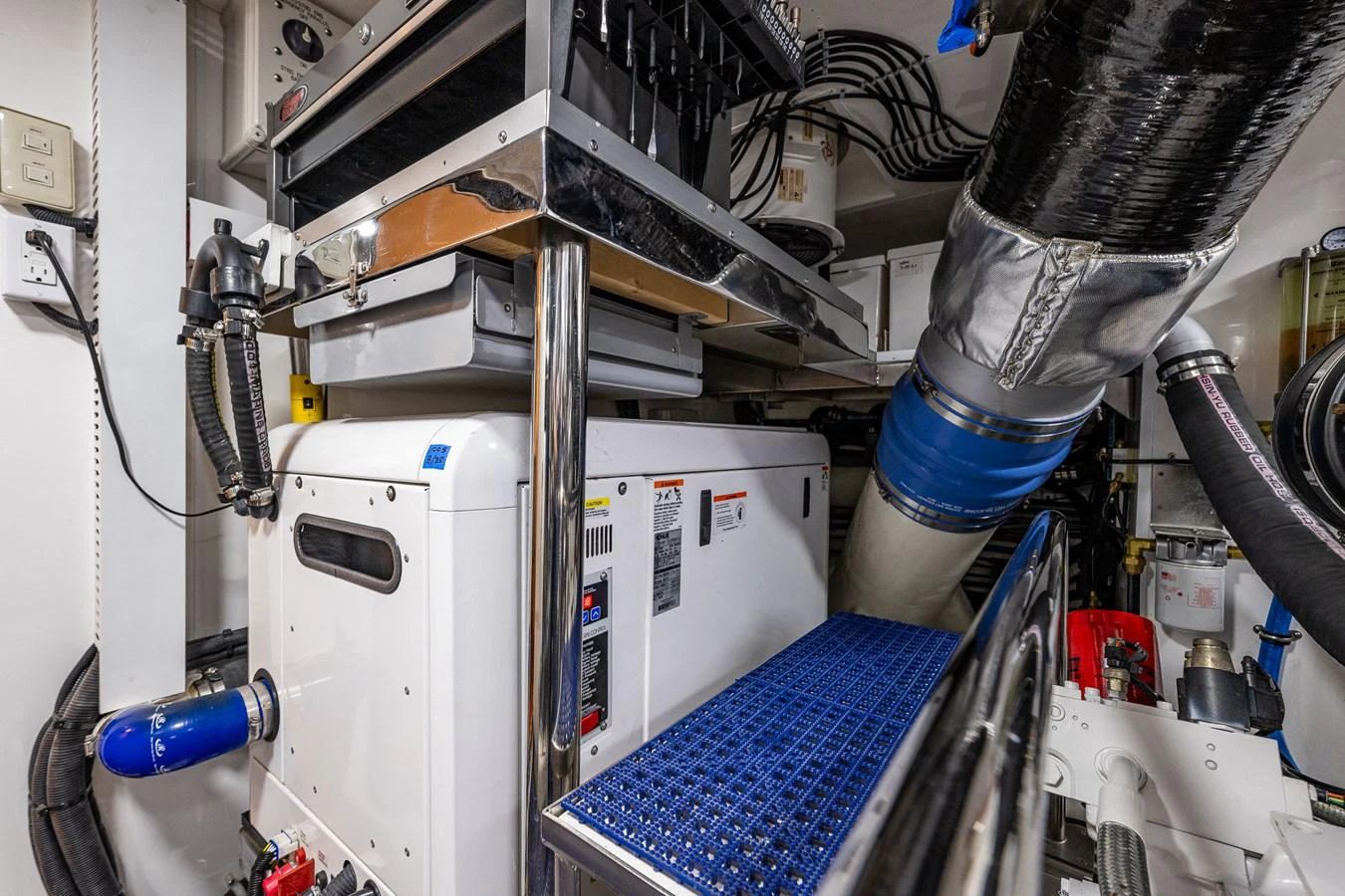 The image showcases the well-maintained engine room of the yacht, highlighting its advanced mechanical systems. aboard ISLAND BREEZE Yacht for Sale
