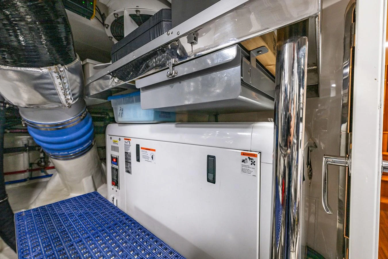 The image showcases the engine room with various machinery and equipment. aboard ISLAND BREEZE Yacht for Sale
