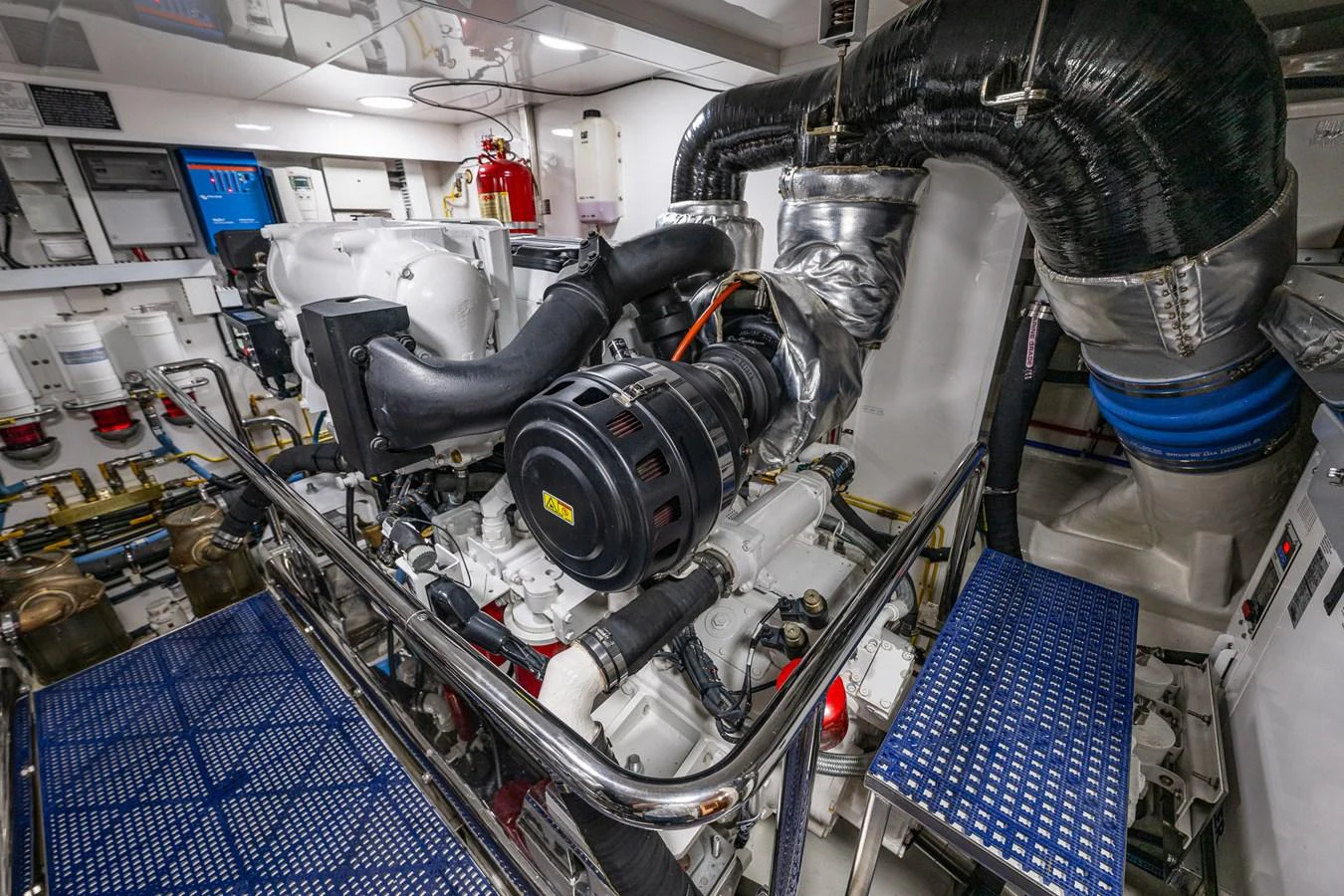 The yacht's engine room showcases advanced machinery and meticulous organization. aboard ISLAND BREEZE Yacht for Sale