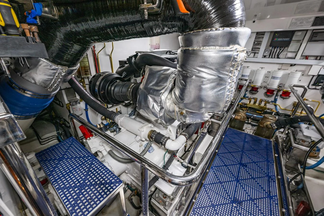 The image showcases the yacht's well-maintained engine room with advanced machinery and equipment. aboard ISLAND BREEZE Yacht for Sale