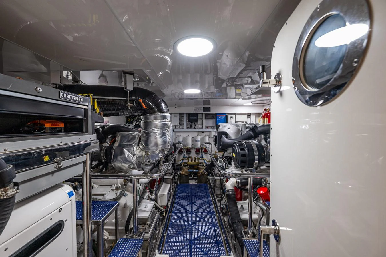 The engine room showcases a well-organized and meticulously maintained space with advanced machinery. aboard ISLAND BREEZE Yacht for Sale