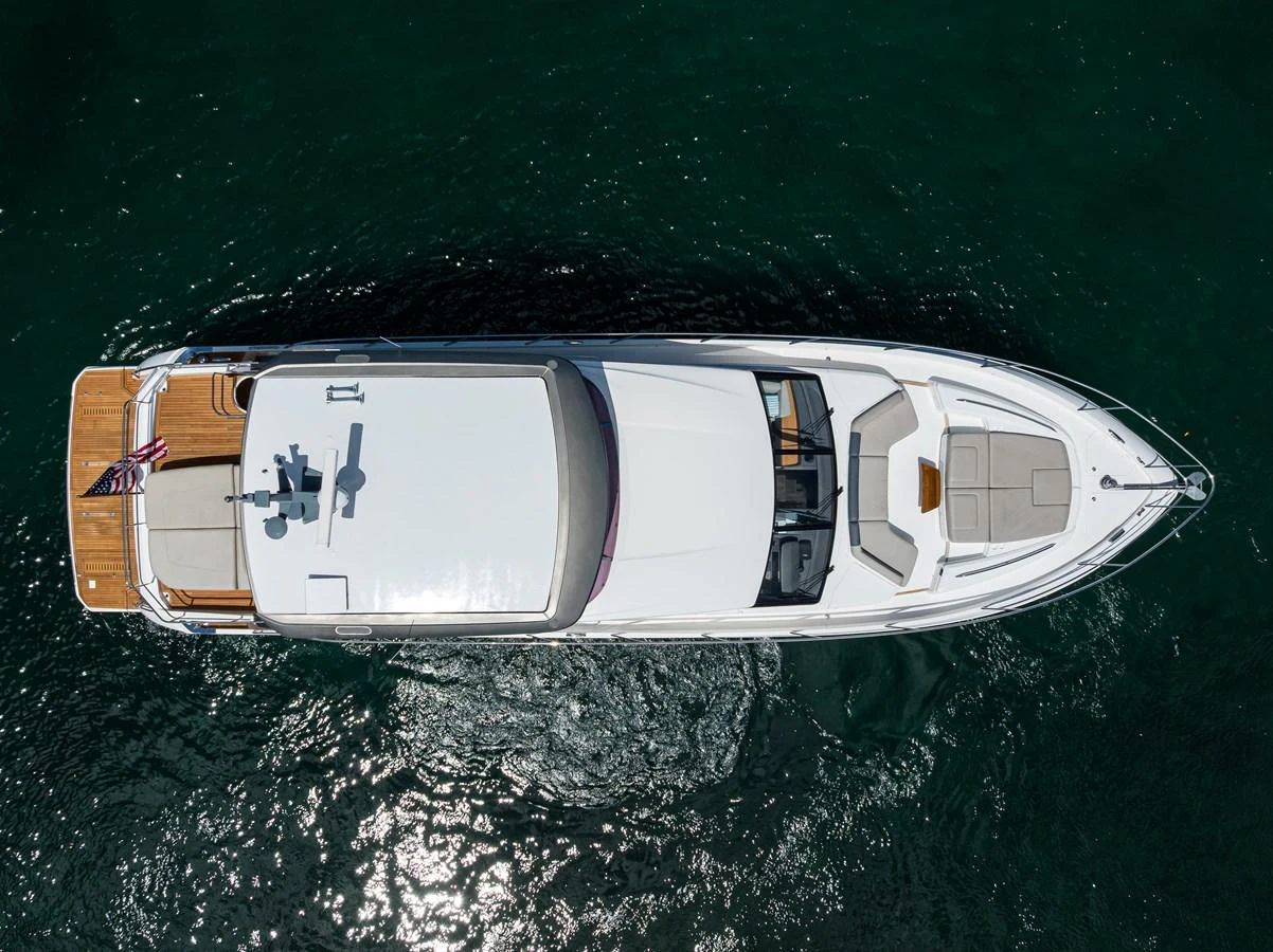 A sleek yacht is captured from an aerial view, showcasing its elegant design and spacious deck areas. aboard MISS AMY Yacht for Sale