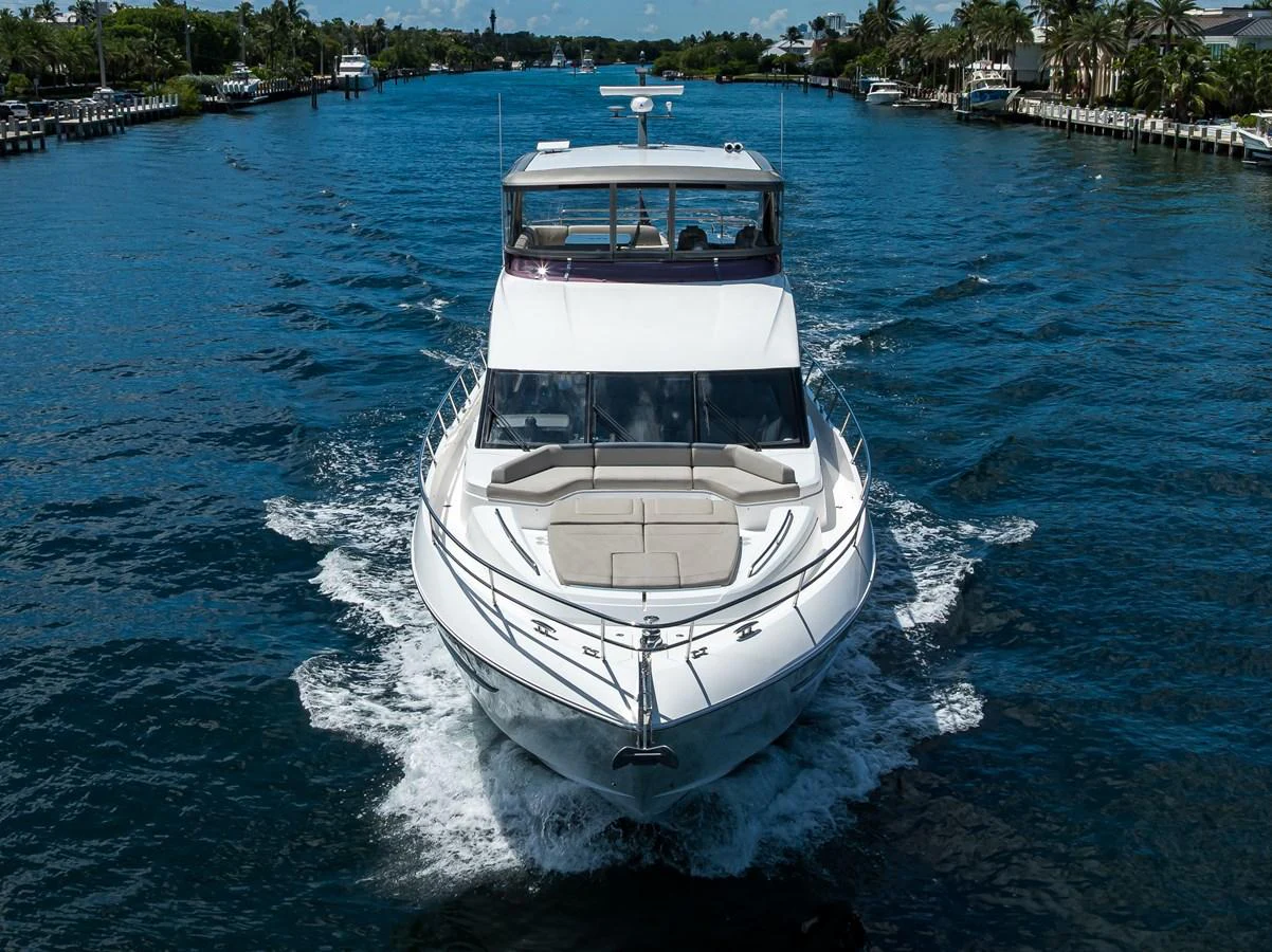 A luxurious yacht cruises through a serene waterway, showcasing its sleek design and spacious deck. aboard MISS AMY Yacht for Sale