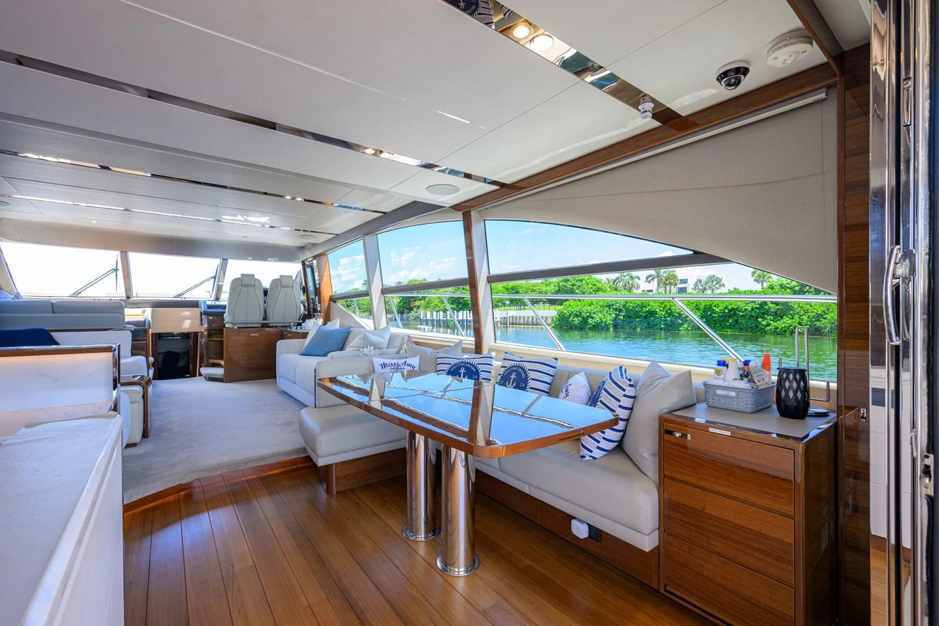 The salon offers a spacious and elegant area with panoramic windows and luxurious seating. aboard MISS AMY Yacht for Sale