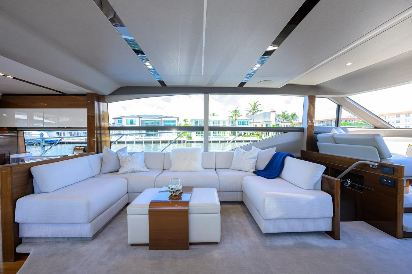 The salon features a spacious and elegant seating area with large windows offering panoramic views. aboard MISS AMY Yacht for Sale