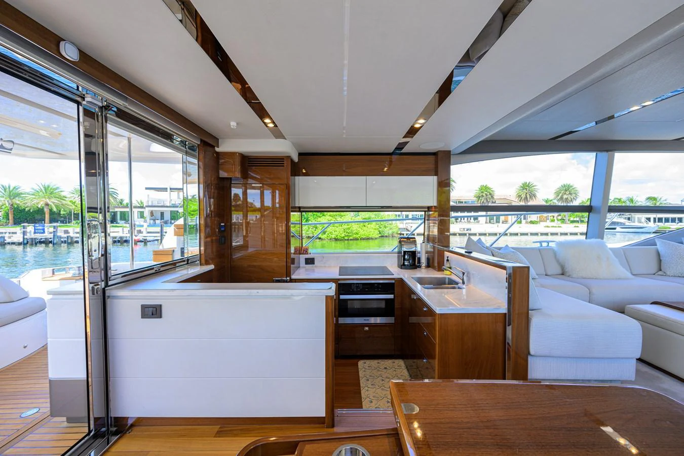 The yacht's galley features modern appliances and luxurious finishes, seamlessly blending with the open living area. aboard MISS AMY Yacht for Sale